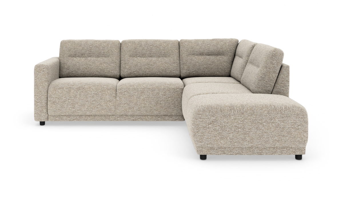 Beige L-formet modulsofa med chaiselong til højre på hvid studiebaggrund.
