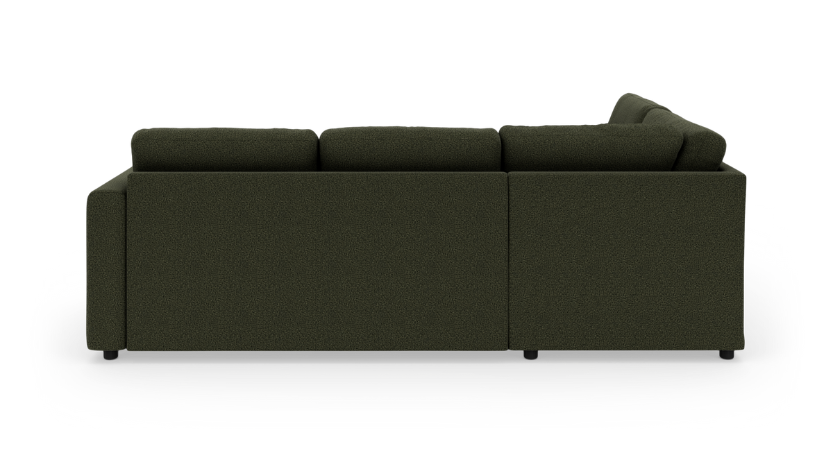 Mørkegrøn modulsofa set bagfra på hvid baggrund.