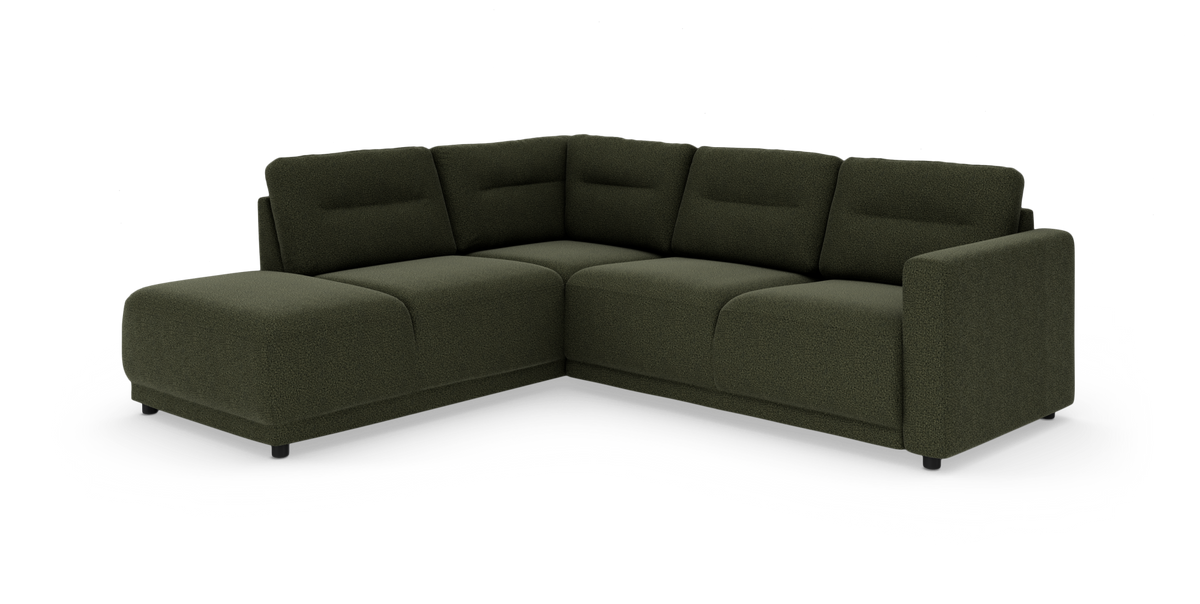 Modulær L‑formet hjørnesofa i mørkegrønt stof på hvid baggrund.