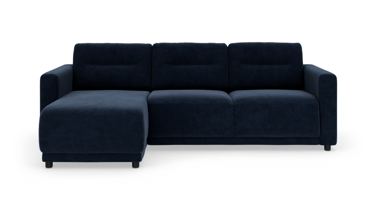 Mørkeblå modulsofa med venstre chaiselong, fotograferet direkte forfra mod hvid studiebaggrund.