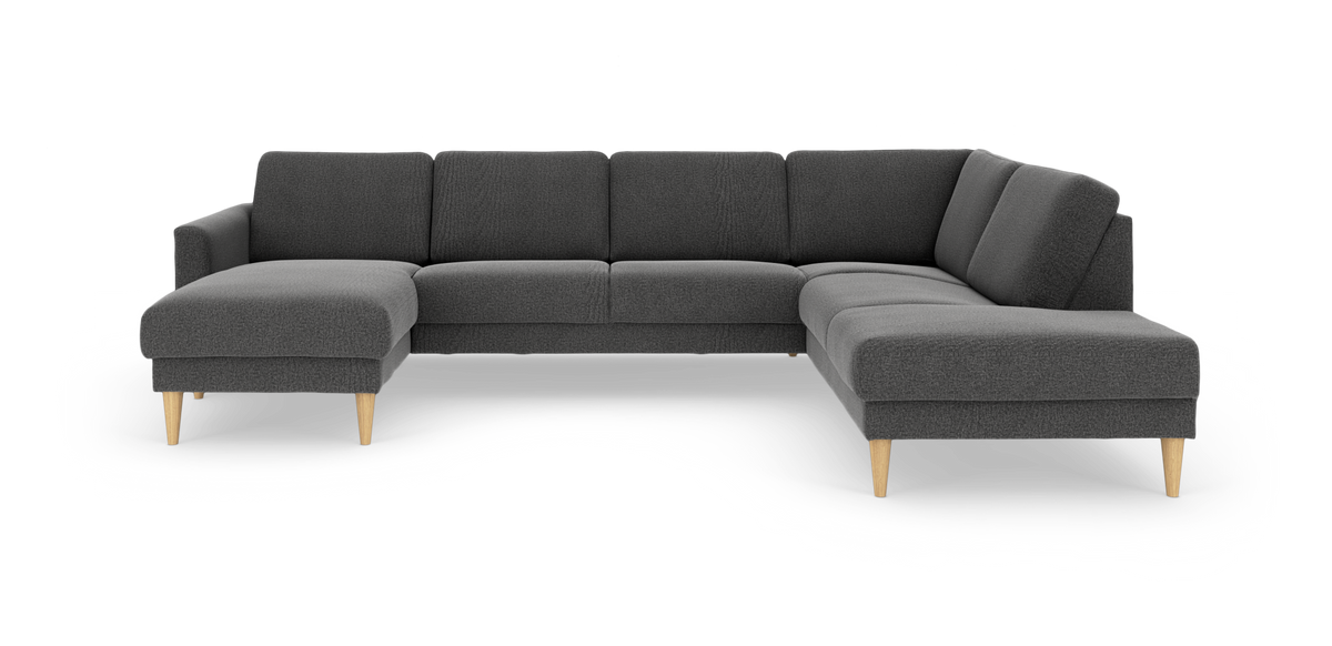 Mørkegrå modul-hjørnesofa med venstrevendt chaiselong og åben afslutning til højre, lyse træben.