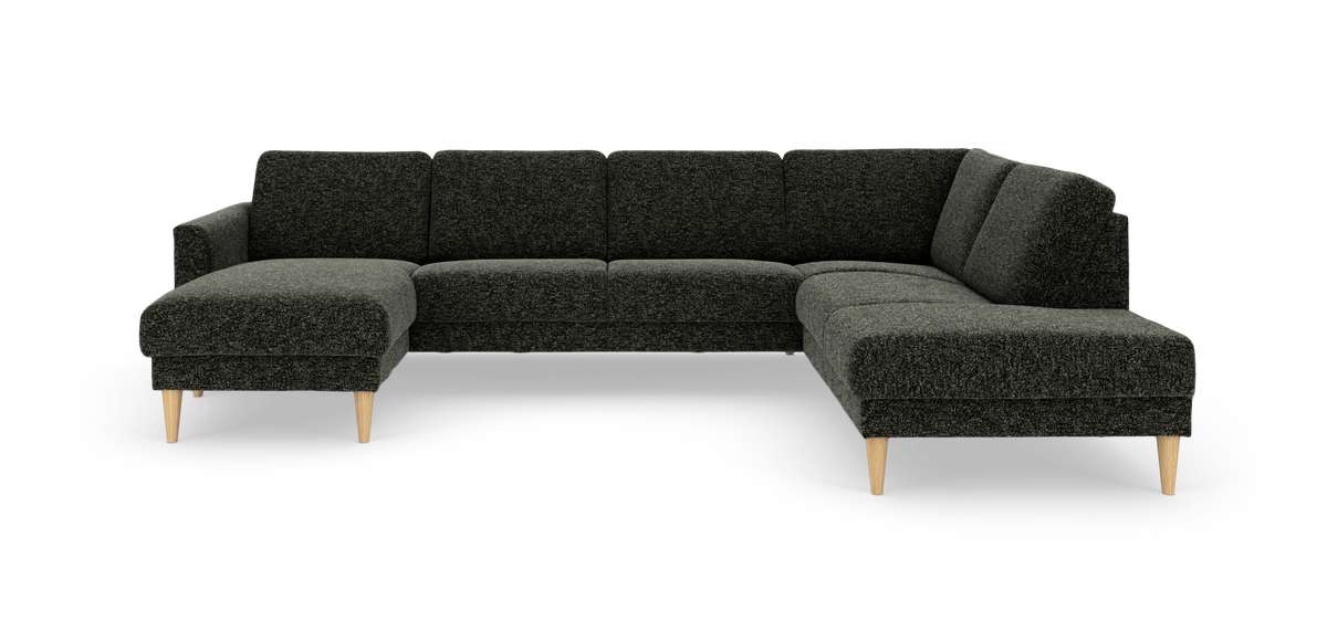 Mørkegrå L‑formet hjørnesofa med chaiselong og lyse koniske træben, frilagt på hvid baggrund.