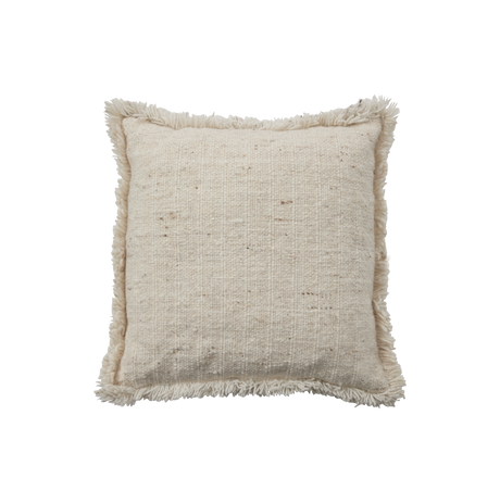 Dråber af beige væske på sort baggrund i et minimalistisk, asymmetrisk udsnit.
