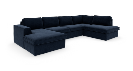 Mørkeblå hjørnesofa i fløjl/plys med venstrevendt chaiselong og brede armlæn, frilagt på hvid baggrund.