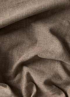 Nærbillede af krøllet beige linnedstof med tydelig vævstruktur.