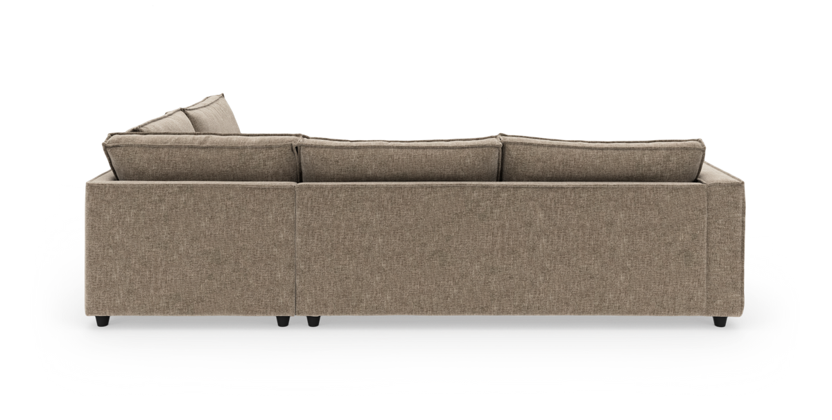 Beigefarvet modulsofa set bagfra på hvid baggrund.