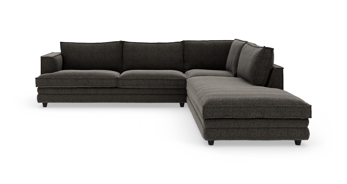 Mørkegrå L‑formet hjørnesofa med chaiselong til højre.