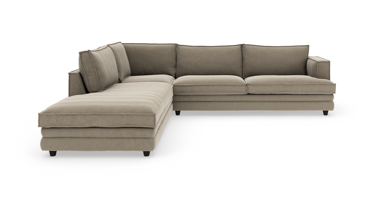 Beige L-formet modulsofa med chaiselong, frilagt på hvid baggrund.