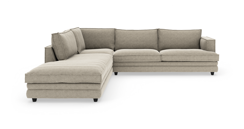 Beige L-formet modulsofa med venstrevendt chaiselong, tykke sædehynder og løse ryghynder på sorte ben._ps
