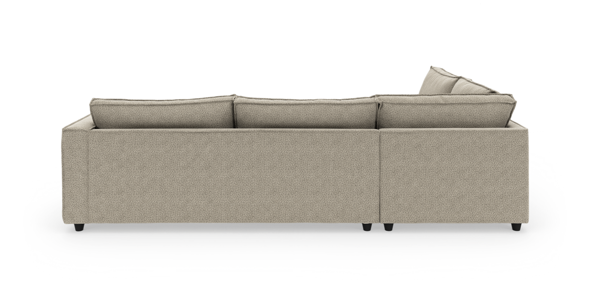 Beige modulsofa set bagfra på hvid studiebaggrund.
