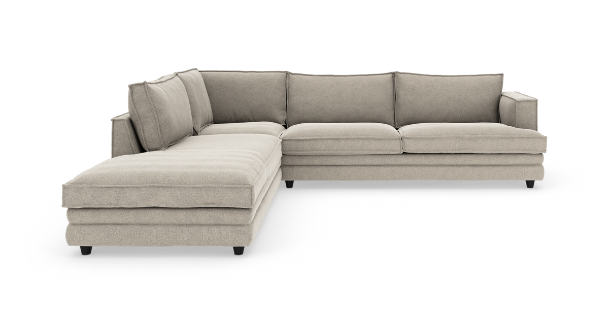 Beige L-formet modulsofa med venstrevendt chaiselong, frilagt på hvid baggrund.