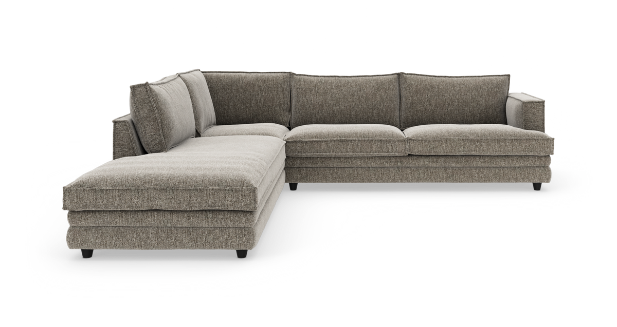L‑formet modulsofa i gråbeige stof på hvid baggrund.