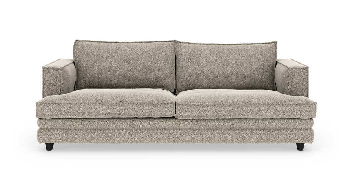 Beige, tosæders sofa med lige armlæn og løse ryghynder, frilagt på hvid baggrund.