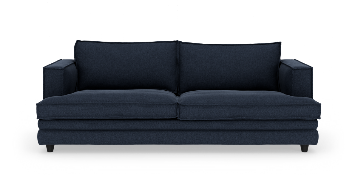 Mørkeblå sofa set forfra, fritlagt på hvid baggrund.