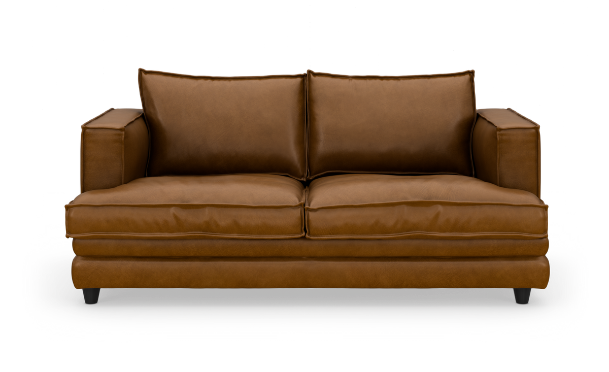Brun lædersofa i studiemiljø set direkte forfra.