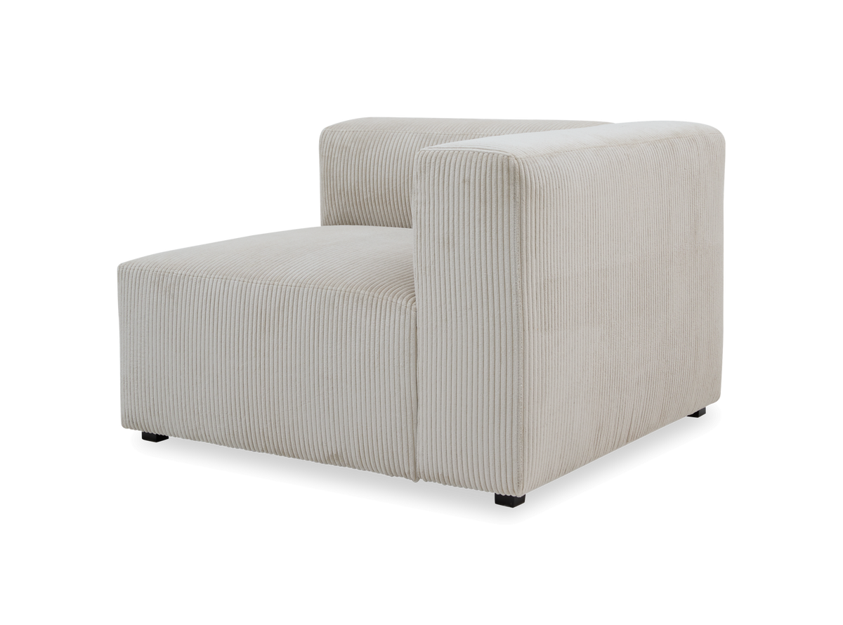 Beige modulsofa‑enhed med højre armlæn i bred fløjl/corduroy, fotograferet i studie på hvid baggrund.