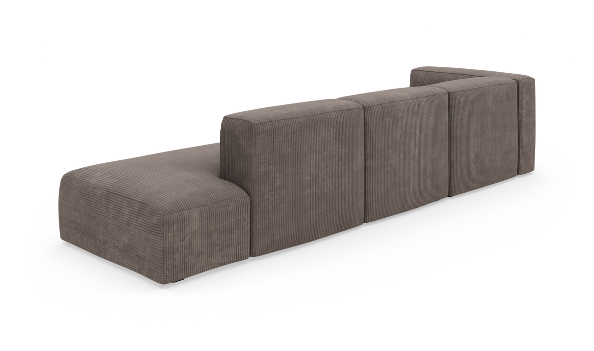 Modulsofa i brungrå bredriflet fløjl med lav ryg, fritlagt på hvid baggrund.