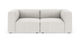 Lys beige modulsofa med brede armlæn, fritstående på hvid baggrund.