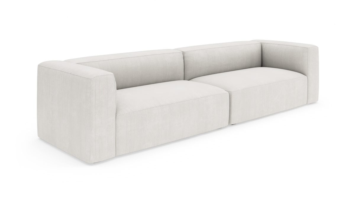 Lys beige modulsofa i moderne, lavrygget design med brede armlæn og to sædemoduler, frilagt på hvid baggrund.