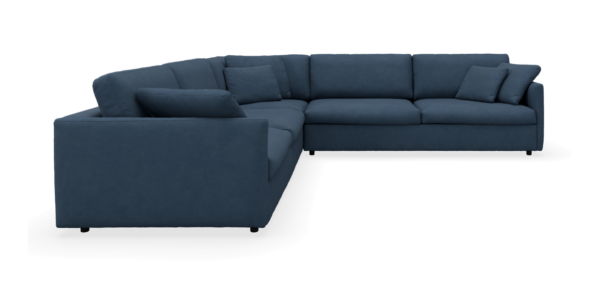 Mørkeblå modul-hjørnesofa med puder, frilagt.