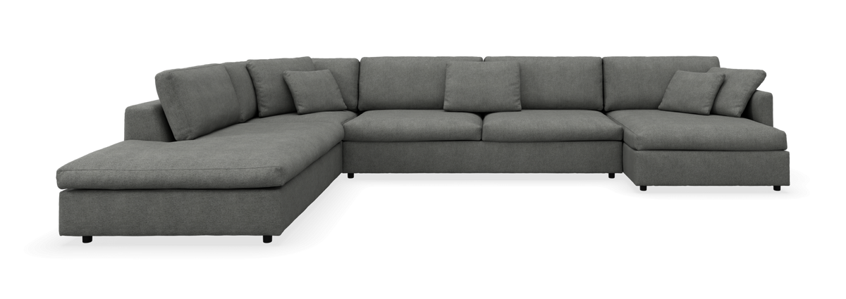 Grå modulsofa i U‑form med chaiselonger på begge sider, set forfra.