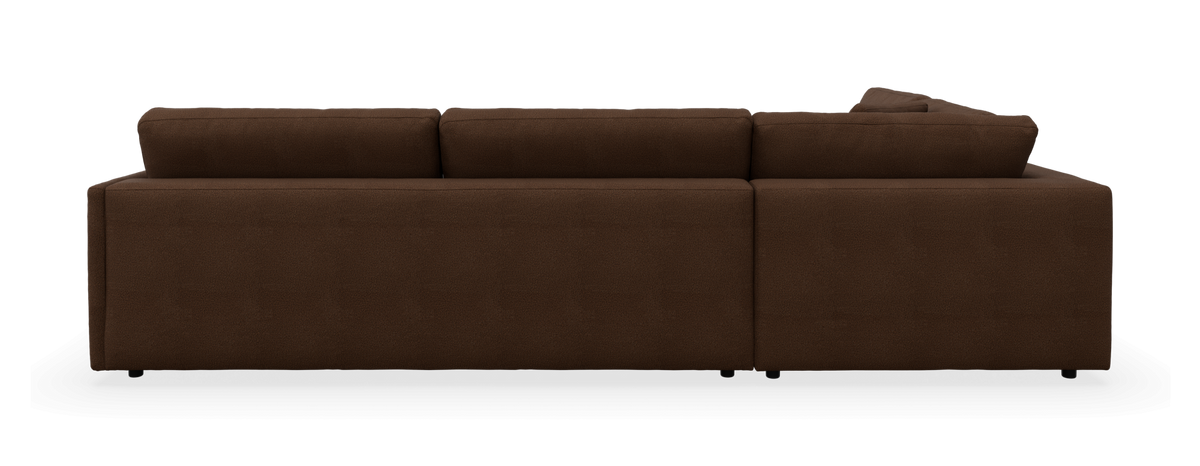 Brun modulsofa med chaiselong til højre, set bagfra.