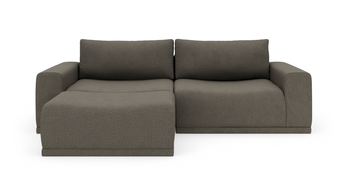 Modulsofa med venstrevendt chaiselong i mørkegråt stof, fotograferet lige for i studie.