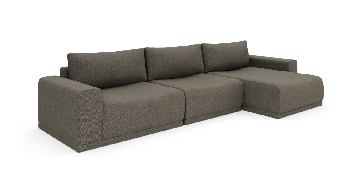 Modulsofa i mørkegråt stof med højre chaiselong, vist i studie på hvid baggrund.