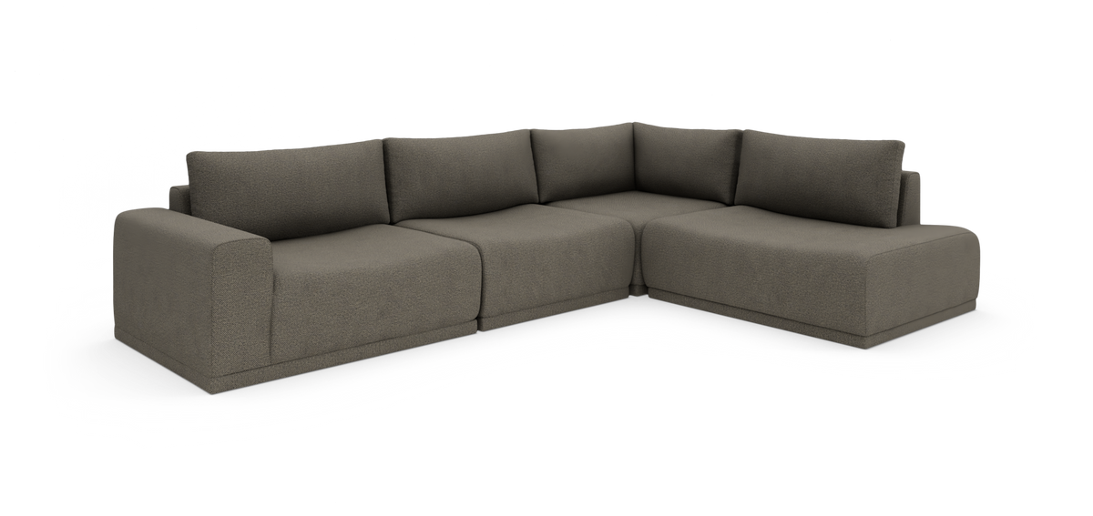 Modulær L-formet hjørnesofa i taupe stof på hvid baggrund.
