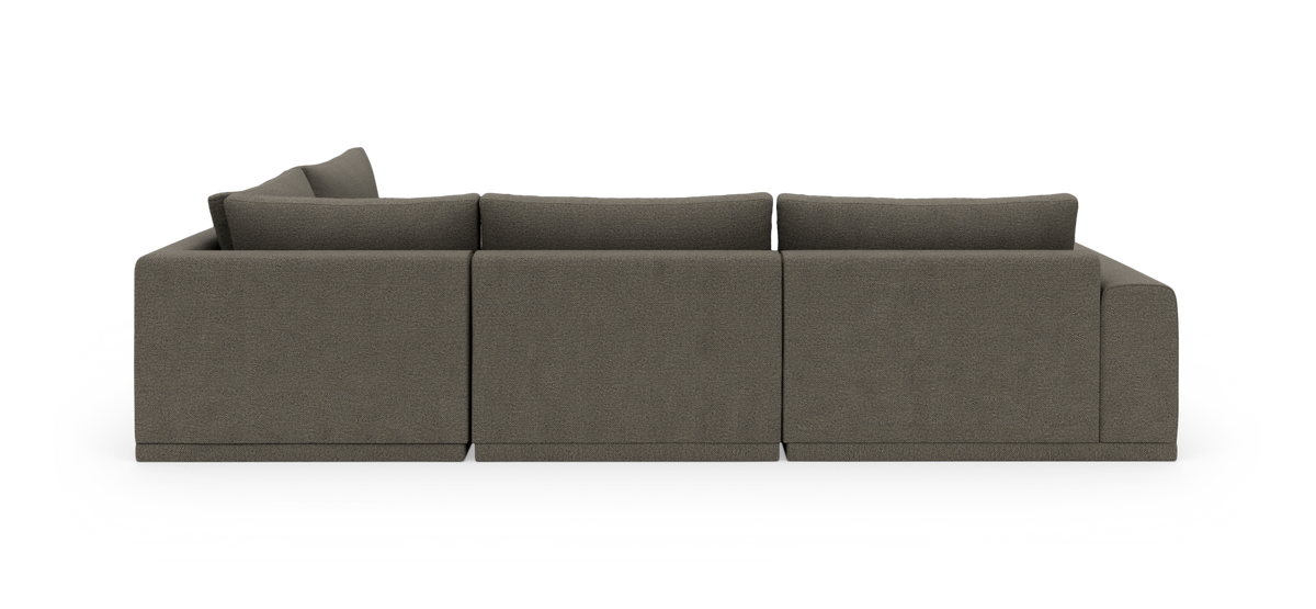 Modulsofa i mørkegråt stof set bagfra, tre sektioner med ryghynder.