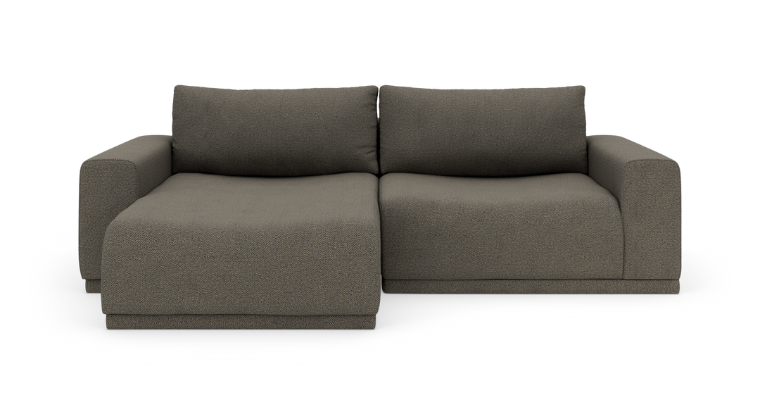 Mørkegrå modulsofa med venstre chaiselong set forfra på hvid baggrund.