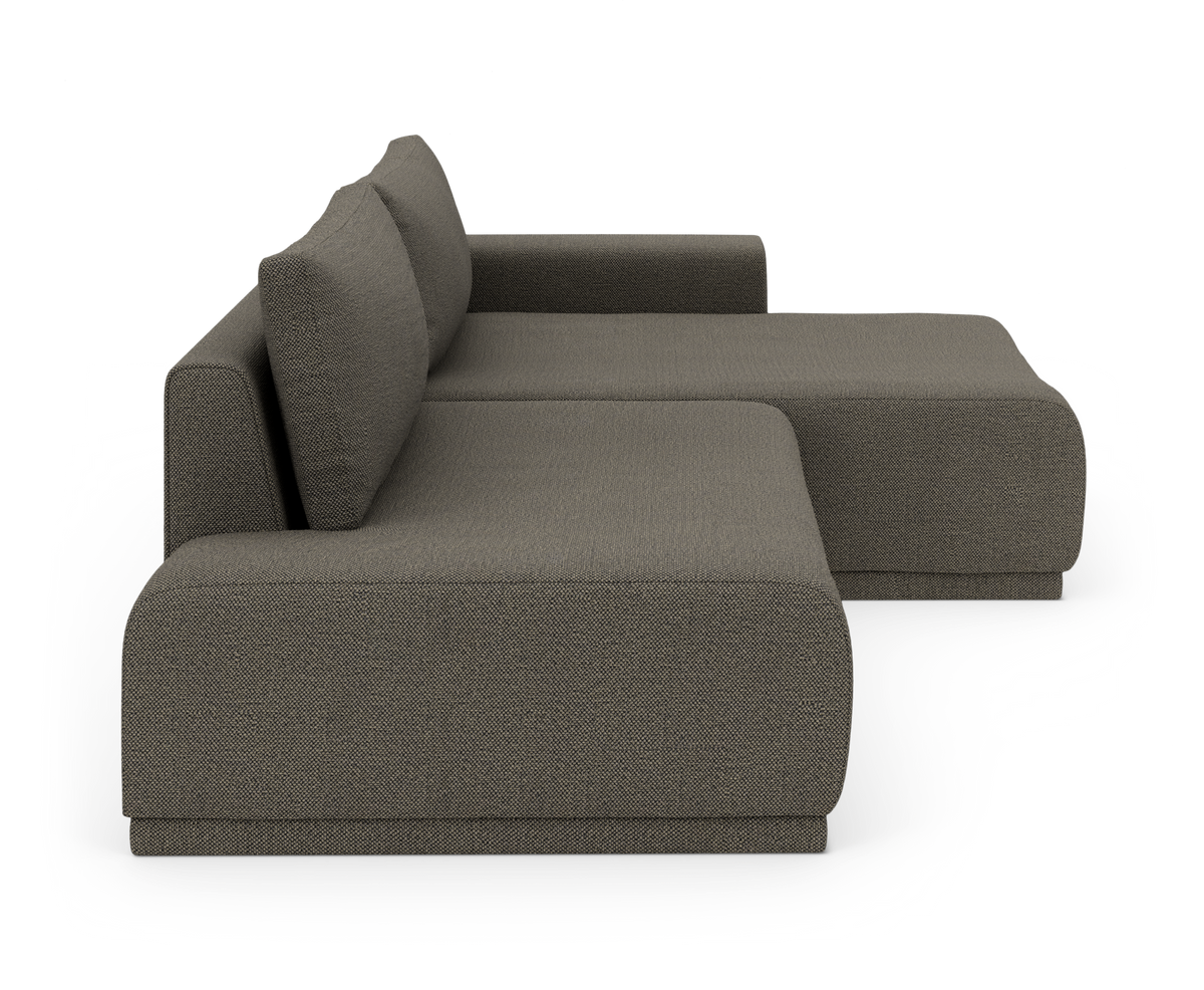 Mørkgrå stofbeklædt modulsofa med chaiselong, venstrevendt, set fra siden.