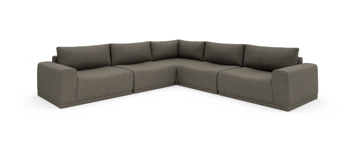 Modulær L‑formet hjørnesofa i taupegråt stof på hvid studiobaggrund.