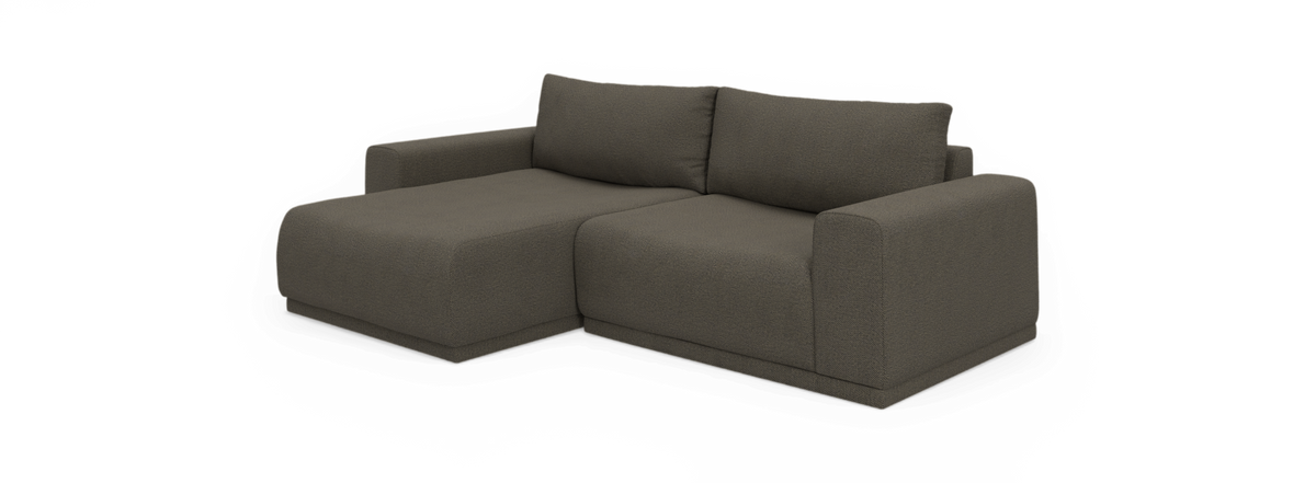 Modulsofa med venstrevendt chaiselong i mørkegråt stof, frilagt på sort baggrund.