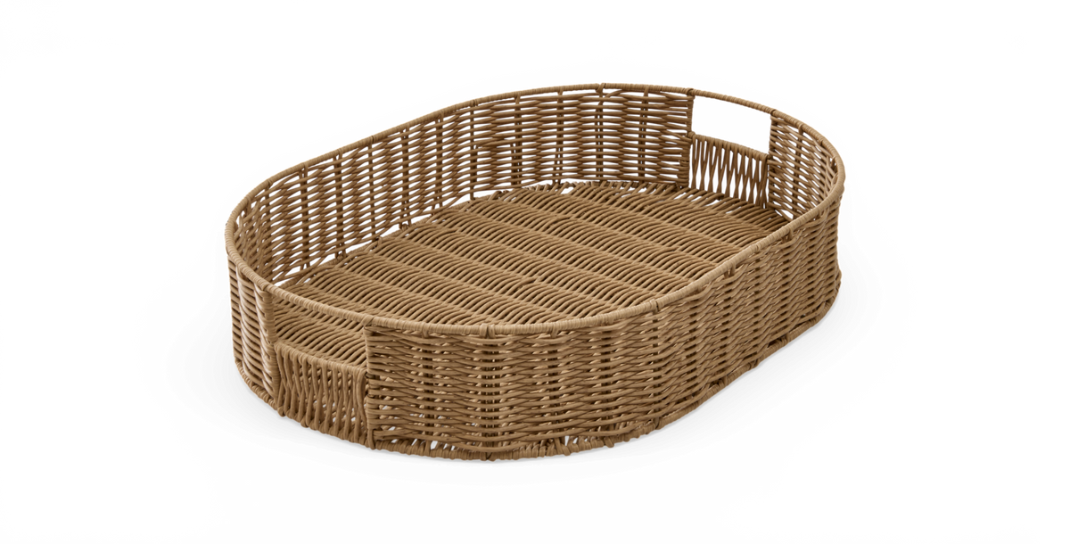 Oval fletbakke i rattan med integrerede håndtag, frilagt.