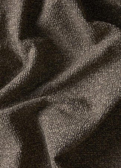 Nærbillede af tekstureret stof i varm grå‑beige tone med bløde folder.