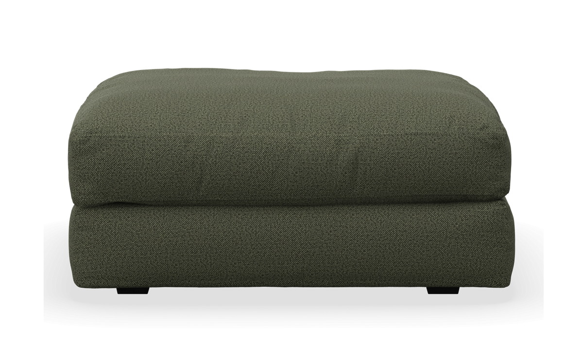 Grøn stofpuf/ottoman set forfra.