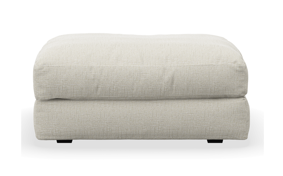 Lys beige ottoman/puf i tekstil set forfra.