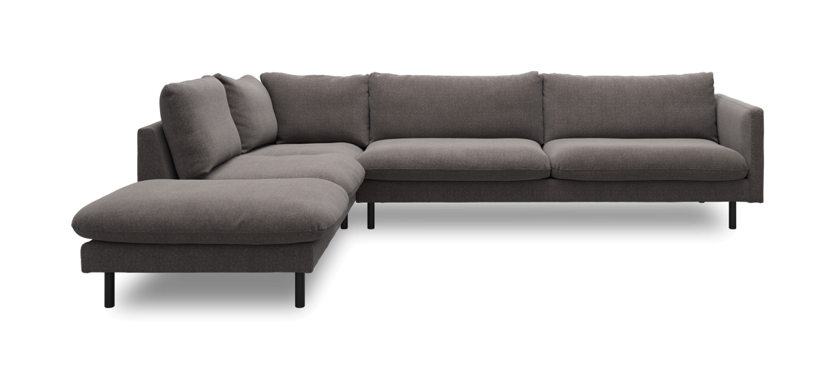 Mørkegrå L-formet hjørnesofa med venstre chaiselong og slanke sorte ben.