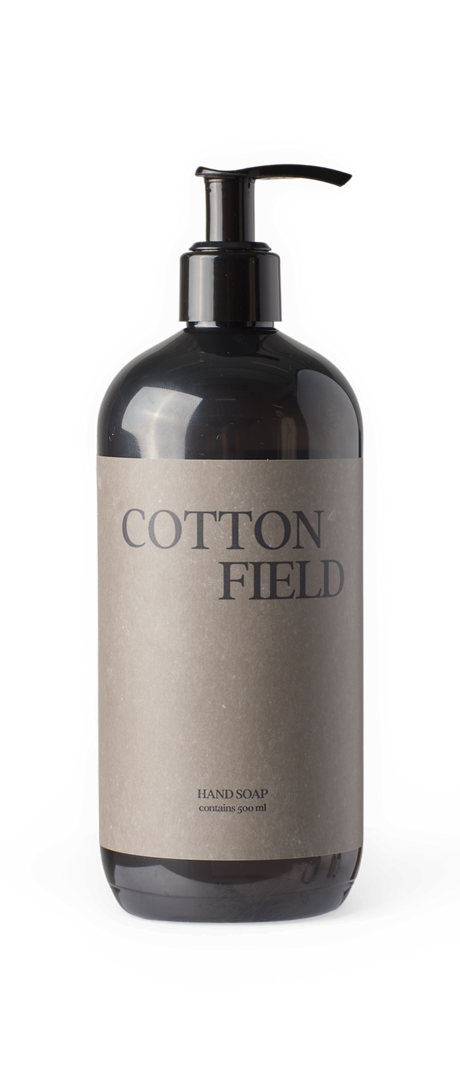 Sort pumpeflaske med etiketten 'COTTON FIELD' håndsæbe, indeholder 500 ml.