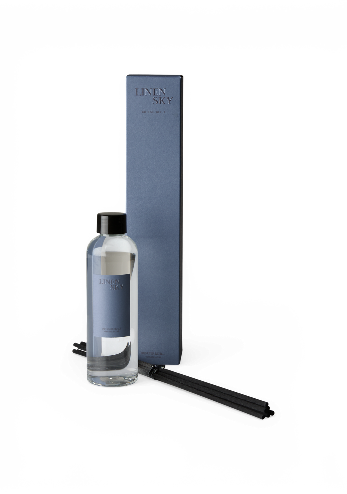 Linen Sky diffuser‑refill med flaske, blå æske og sorte duftpinde.