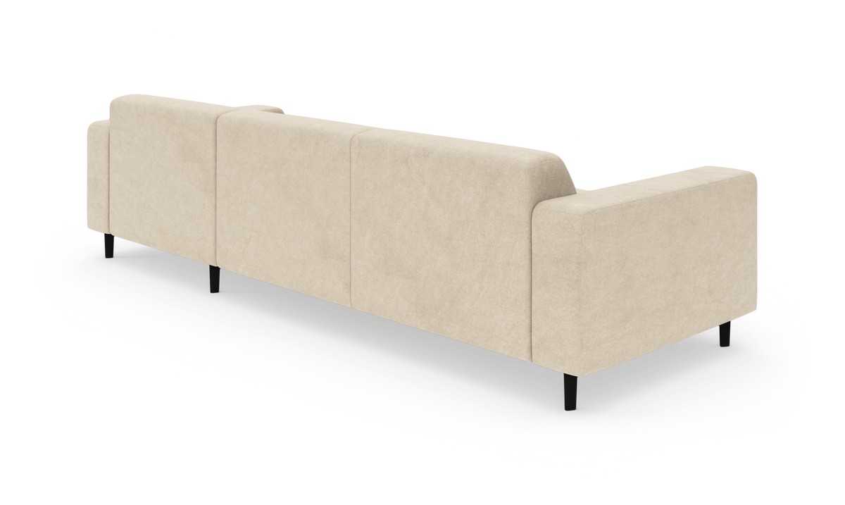 Beige modulsofa set bagfra i studie, med højre armlæn og slanke sorte ben, fritlagt på hvid baggrund.
