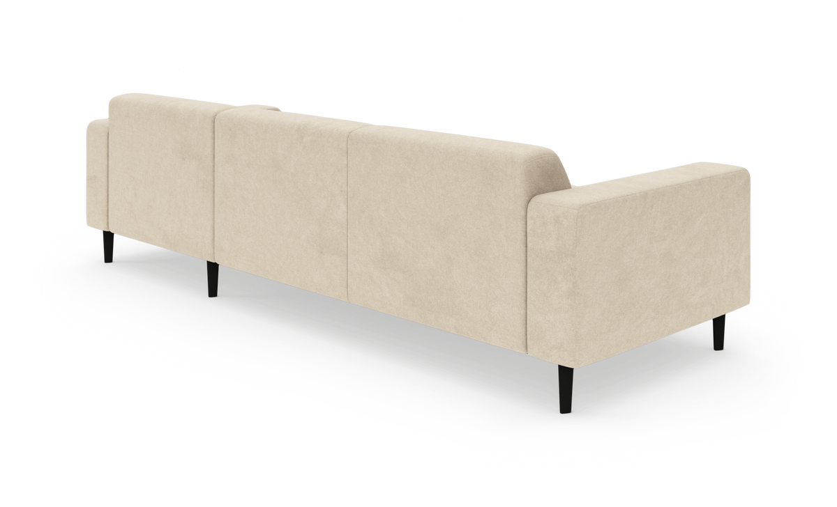 Beige tresædet sofa i moderne stil set skråt bagfra med slanke sorte ben.