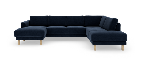 Mørkeblå hjørnesofa med chaiselong og lyse træben på hvid baggrund.