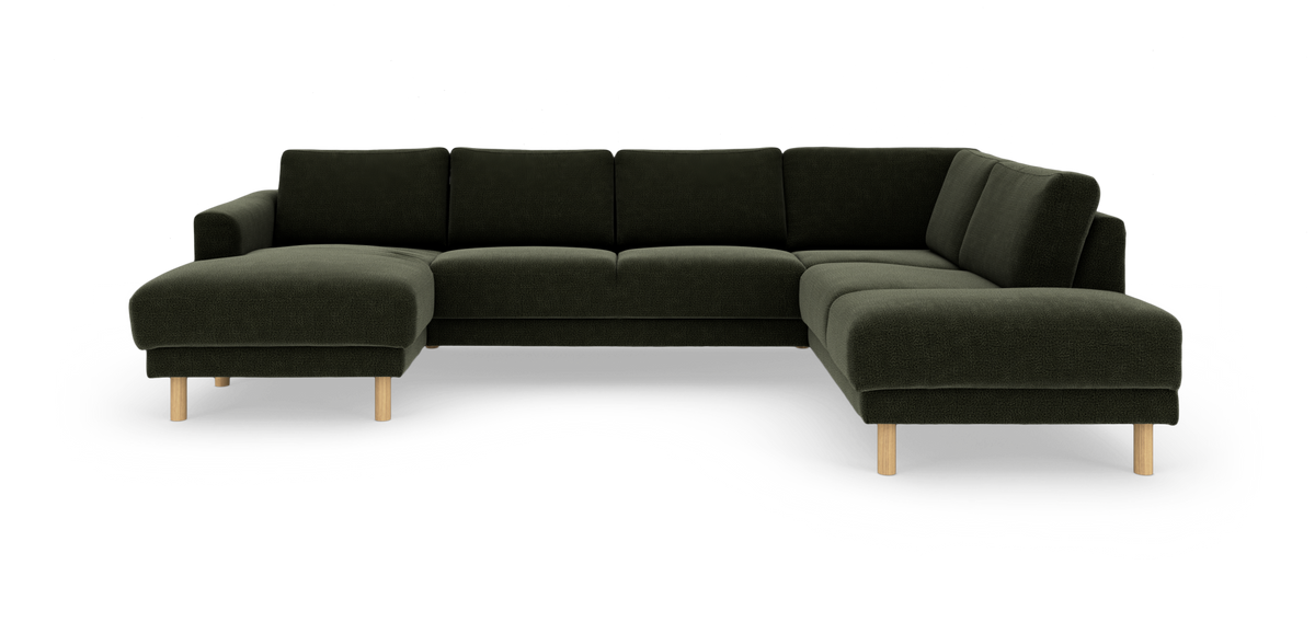 Mørkegrøn U-sofa med chaiselong i begge ender og runde træben.