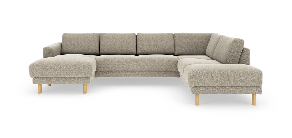 Beige U‑formet modulsofa med chaiselong til venstre og afsluttende divan til højre, runde træben.