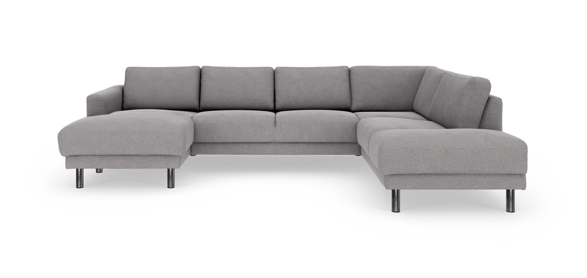 Grå L‑formet hjørnesofa med chaiselong og kromben, frilagt på hvid baggrund.