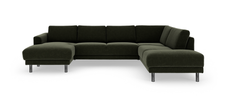 Mørkegrøn modulsofa i U‑form med metalben, fritlagt i studiemiljø.