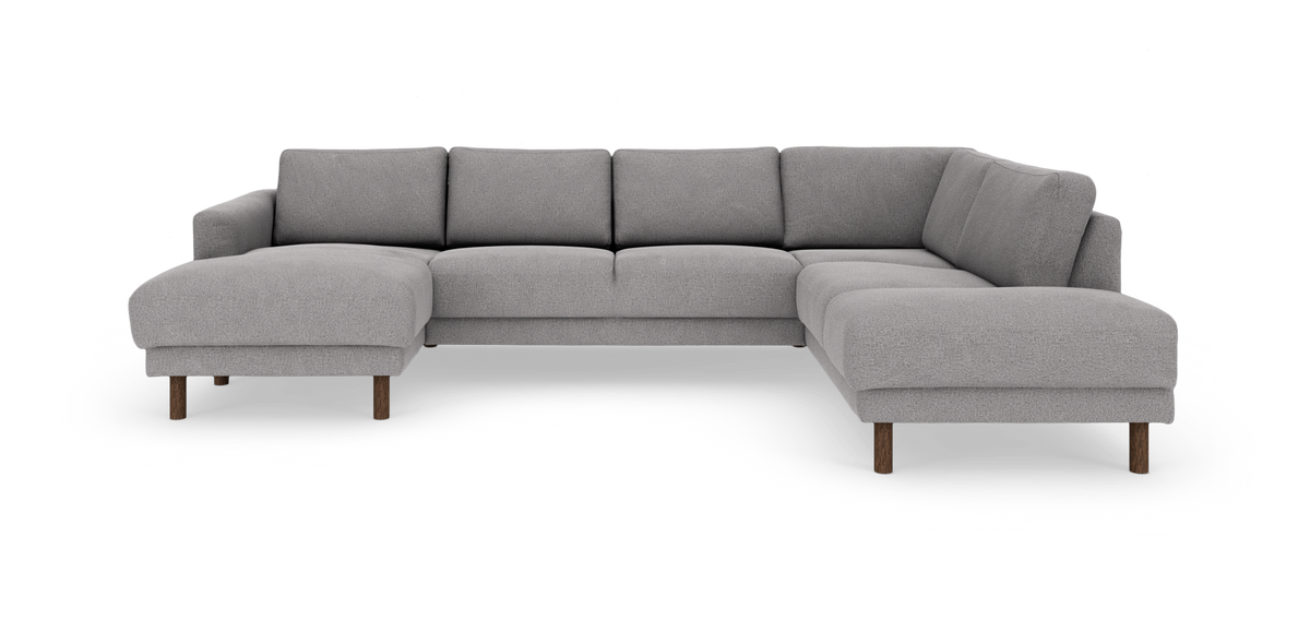 Grå modulær hjørnesofa med chaiselong til venstre og åbent afslut til højre, på træben.