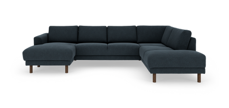 Mørkeblå hjørnesofa med chaiselong i begge ender og træben, frilagt på hvid baggrund.
